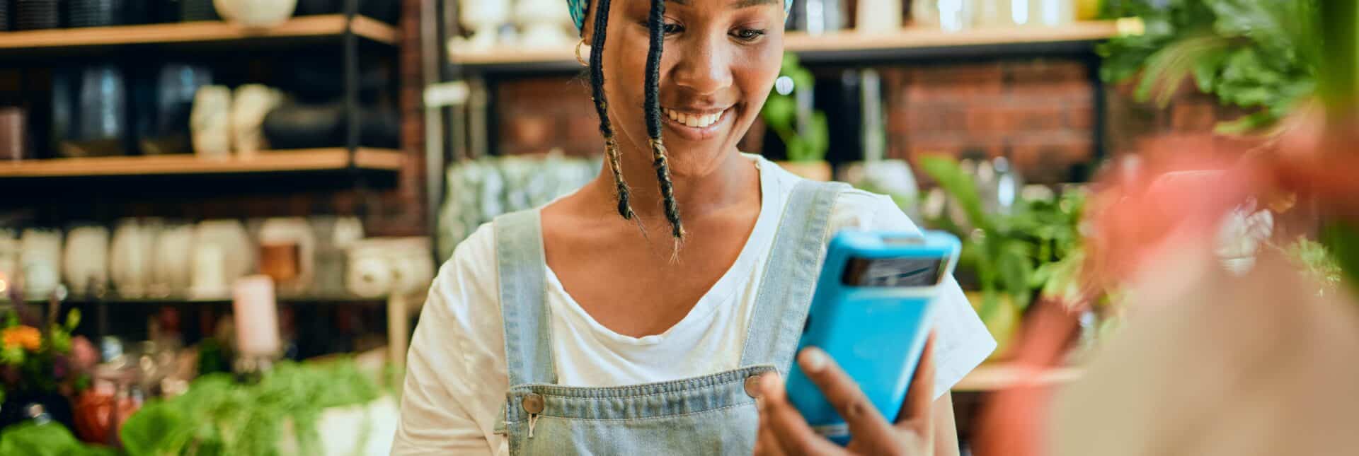 Caller on phone, having video call with tutor