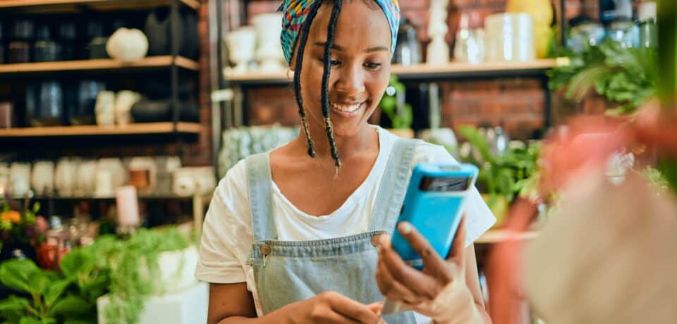 Caller on phone, having video call with tutor