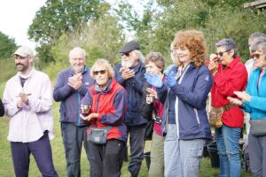 Volunteers celebrating the successful harvest.