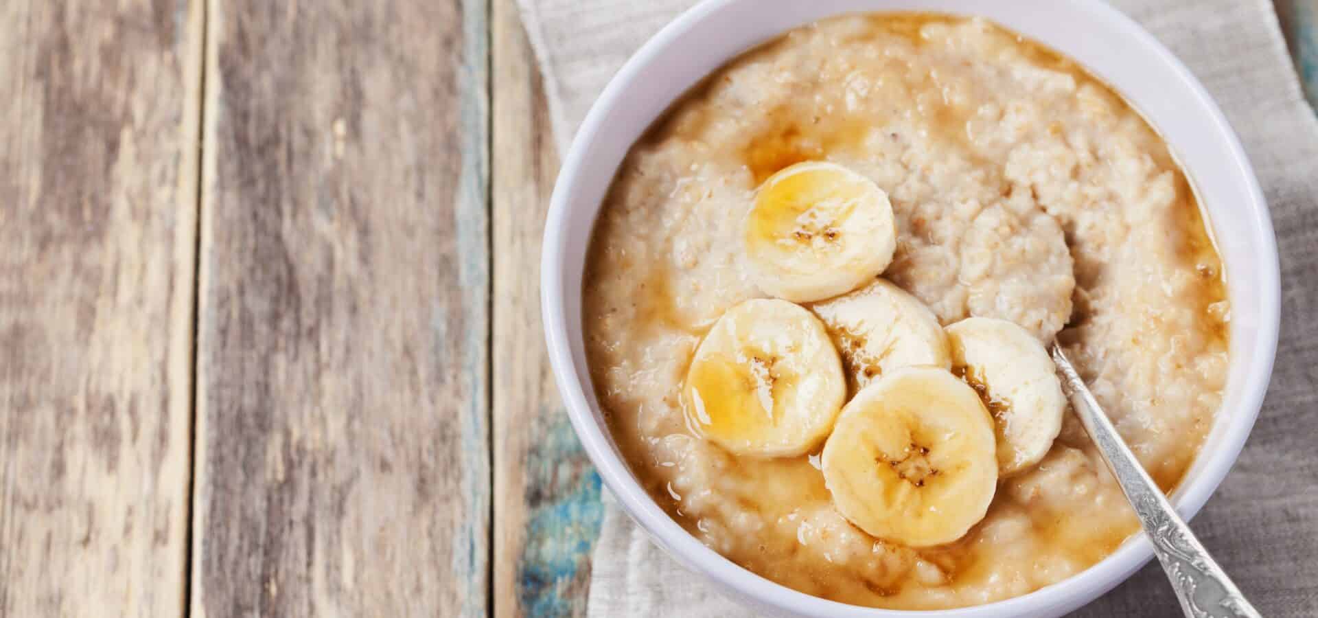 Bowl of porridge with banana and honey