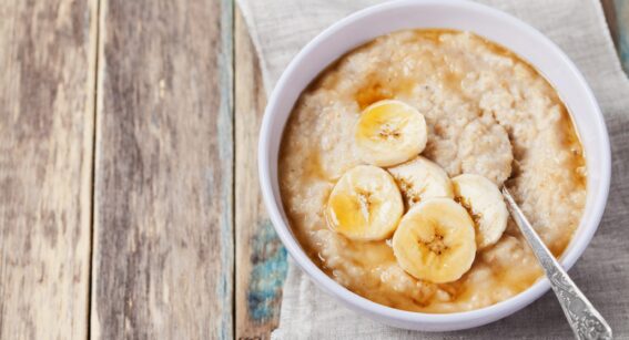 Bowl of porridge with banana and honey