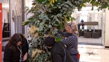 Floristry students at Capel Manor College install floral arch at Claridges Hotel