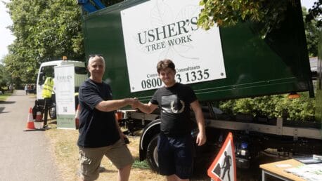 Capel Manor College apprentice shaking hands with a member of staff from new employer - Usher's Tree Work.