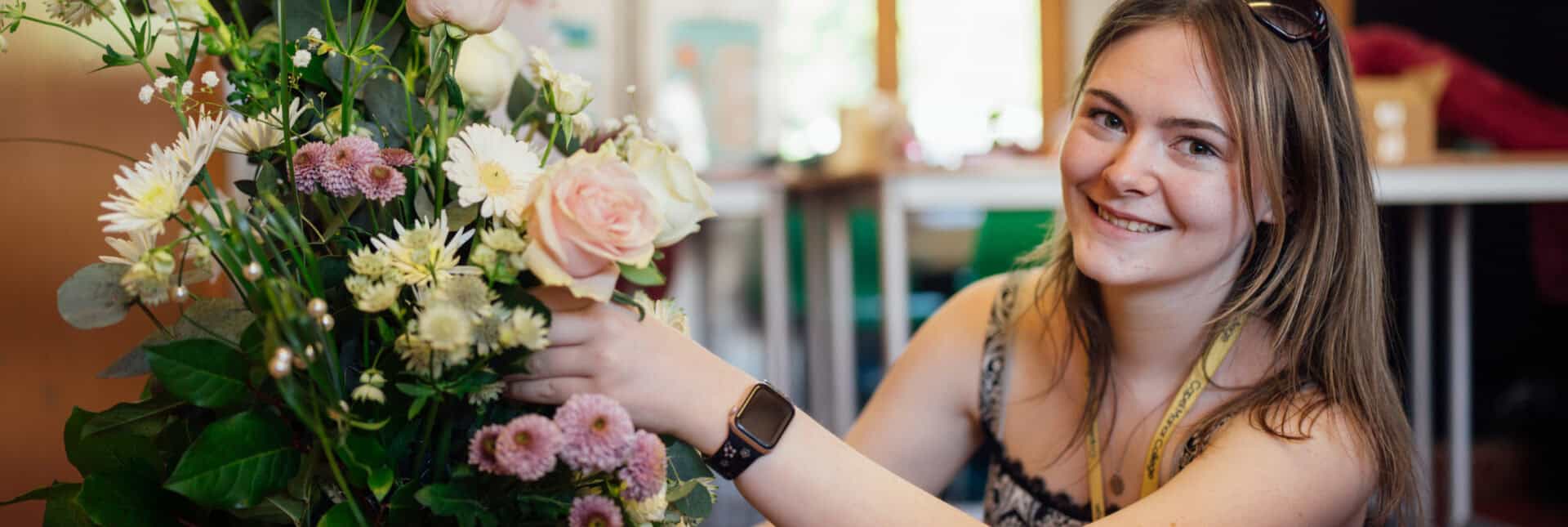 Floristry Student Working on a Bouquet of Flowers