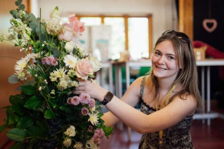 Floristry Student Working on a Bouquet of Flowers