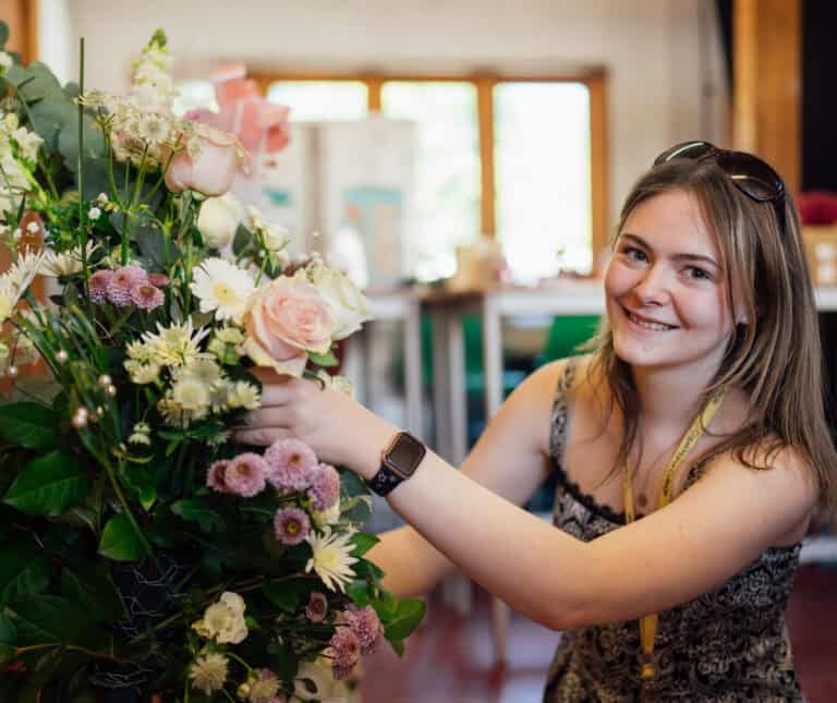 Floristry Student Working on a Bouquet of Flowers