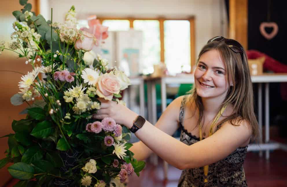 Floristry Student Working on a Bouquet of Flowers