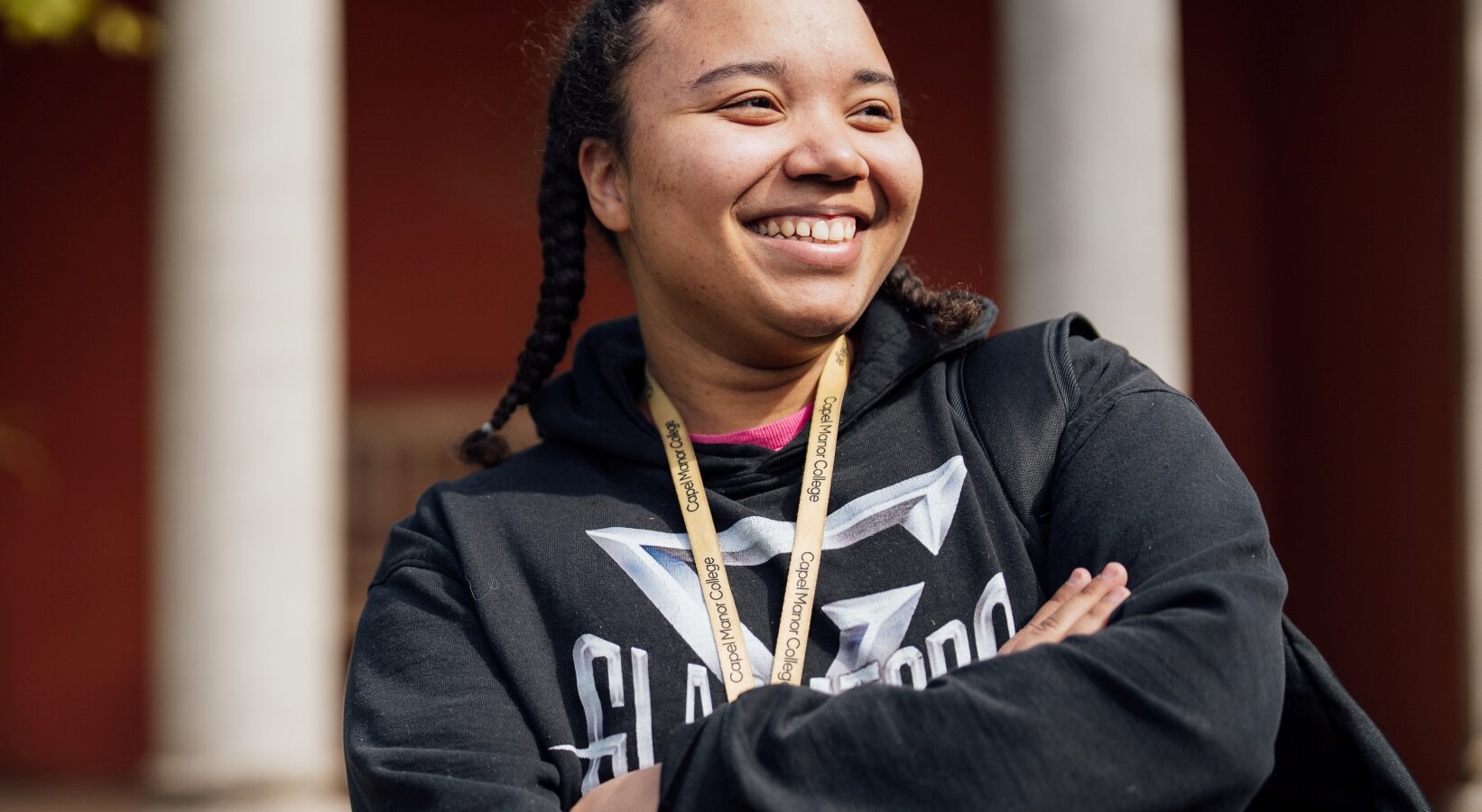 Capel Manor College student relaxing in the grounds of the Enfield Campus.