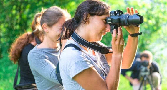 Photography students taking photos during class