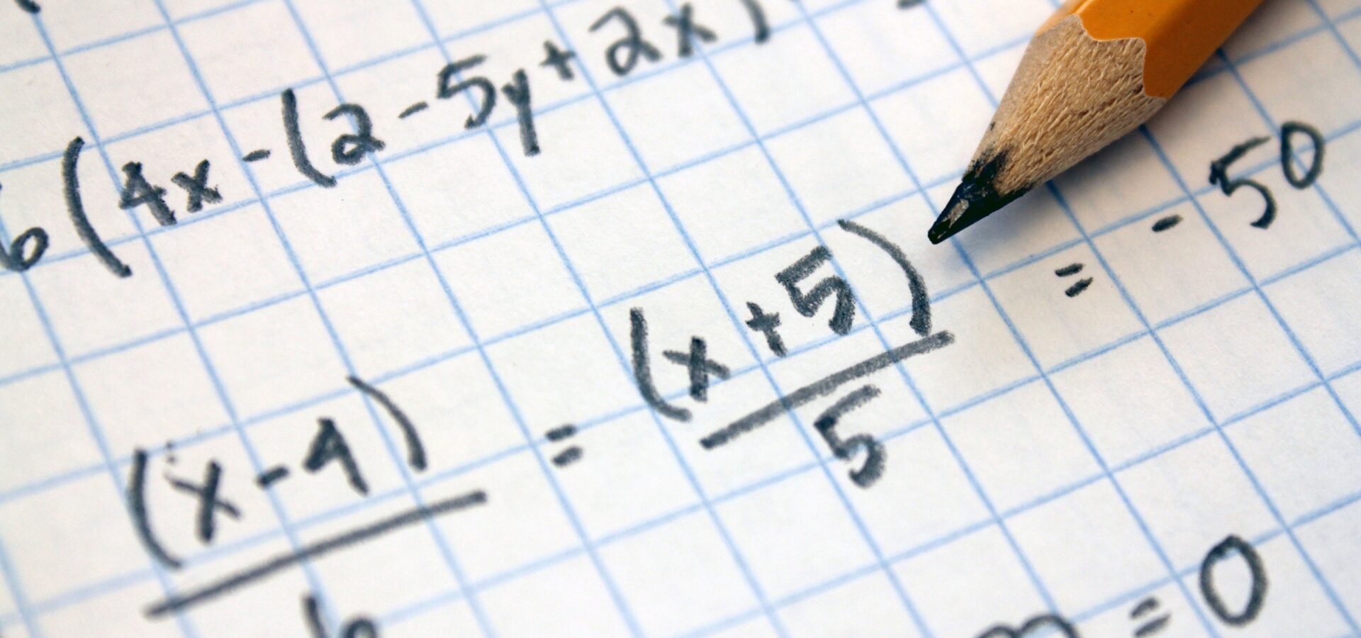 A stock image of a mathematical sum written down on paper.