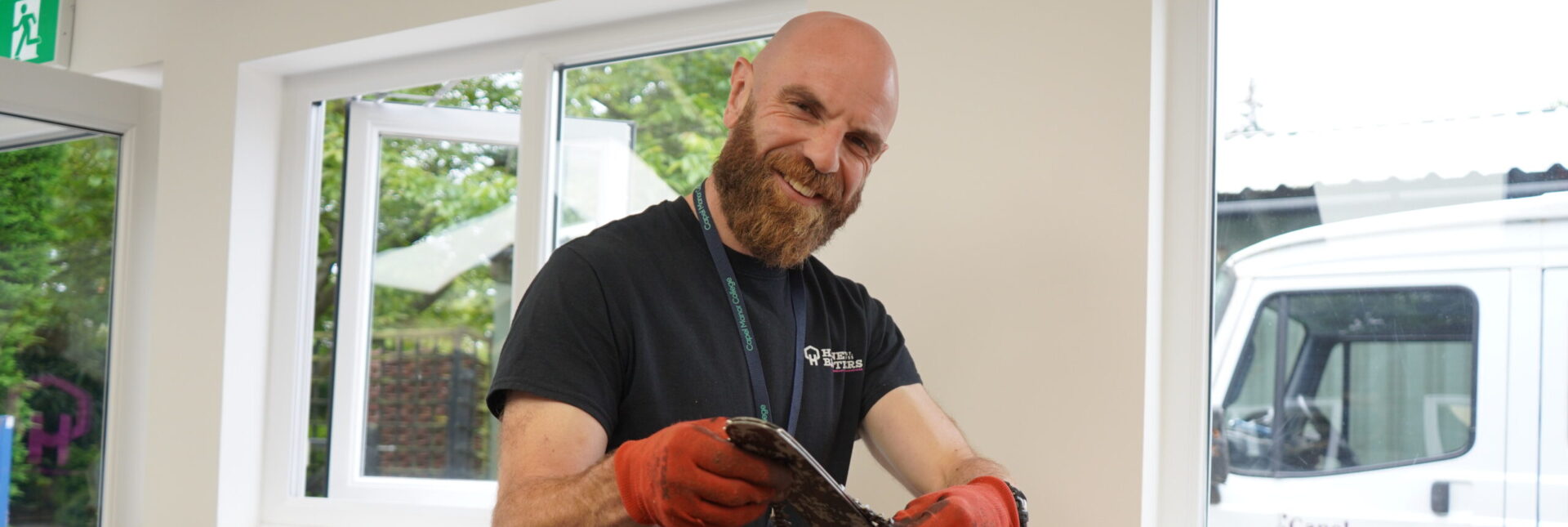 Adult arboriculture student at Capel Manor College with a chainsaw.