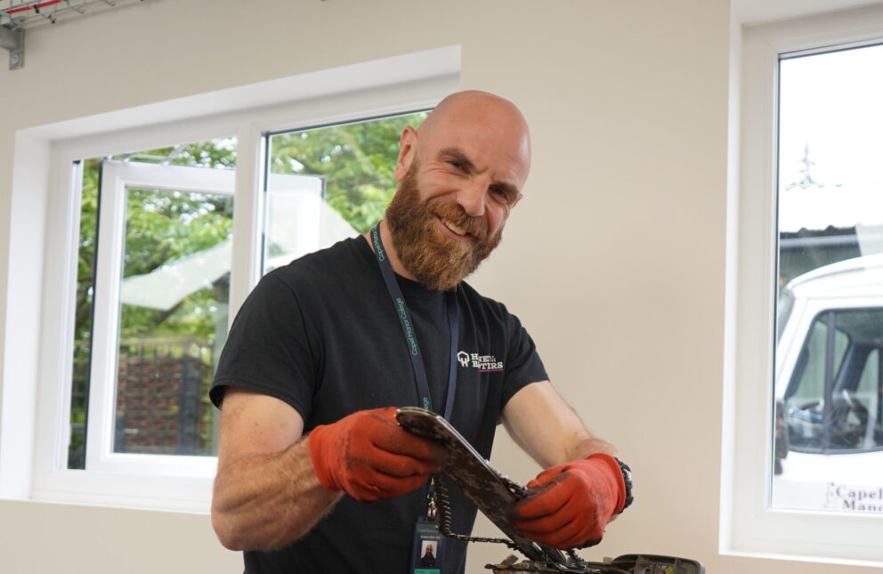 Adult arboriculture student at Capel Manor College with a chainsaw.