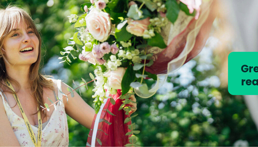 A floristry student at Capel Manor College putting a floral display up outside in the grounds of the Enfield Campus.