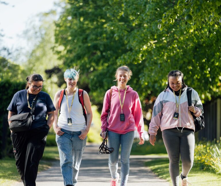 A group of students walking in the grounds of Capel Manor College's Enfield Campus.