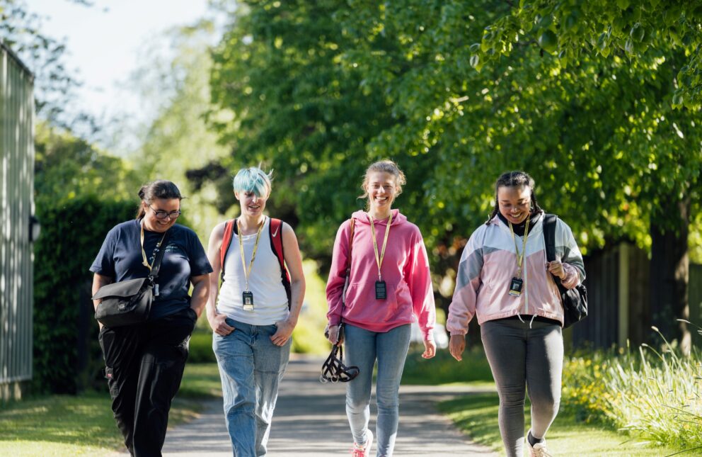 A group of students walking in the grounds of Capel Manor College's Enfield Campus.