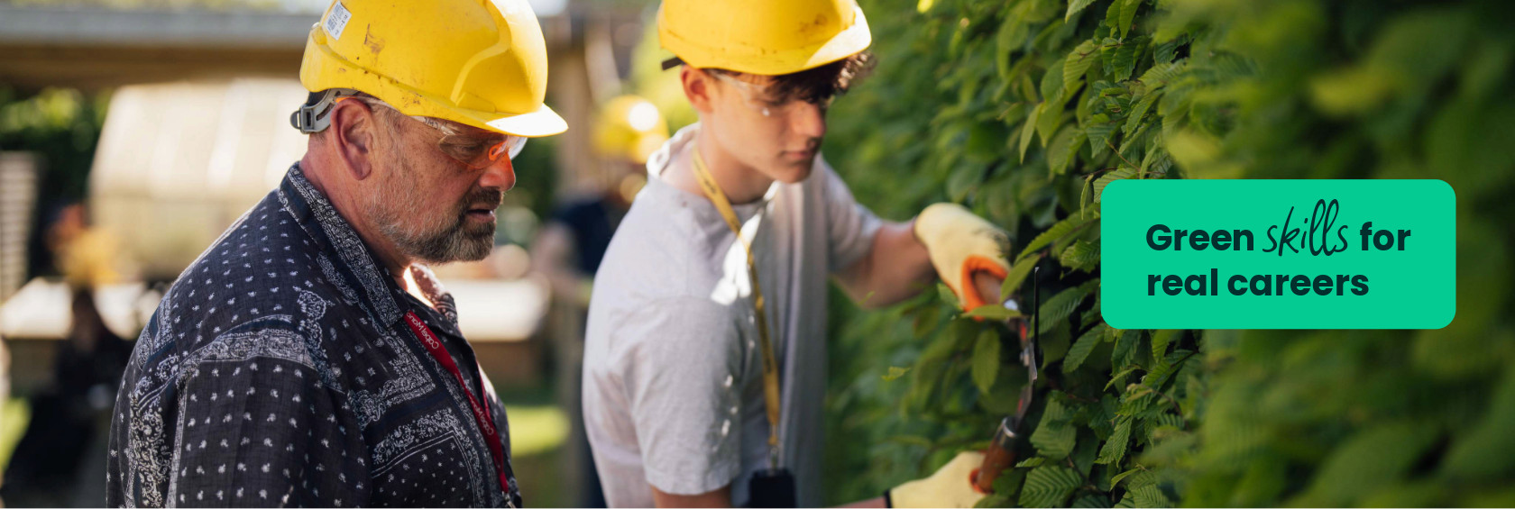 A horticulture student at Capel Manor College being observed by a tutor during a practical session.