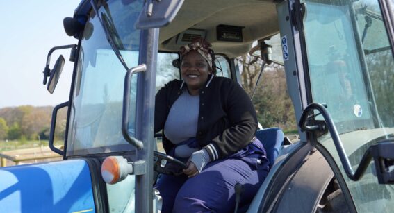 Student at Capel Manor College driving a tractor.