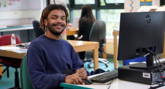 An English and maths student at Capel Manor College in London, studying from a computer.