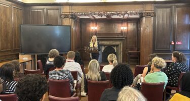 Heather Marks talks to colleagues