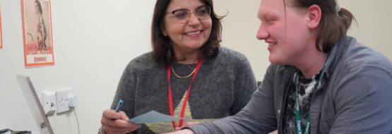 A student at Capel Manor College with a tutor during a learning support session.