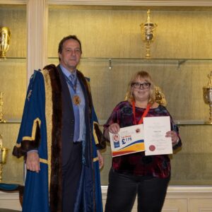 Tamara Hug, a saddlery and shoemaking (leatherwork) student at Capel Manor College in London, being presented with her awards from the Society of Master Saddlers National Saddlery Competition.